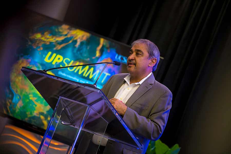 Chancellor Khosla at the UP Summit podium speaking