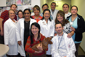 Photo of Dr Ly and staff members