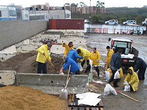 Photo of people filling up sand bags