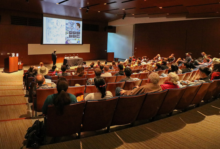 A captivated crowd listens and looks on during “Graphic Science: Comics Engage the Cosmos,” an event recently hosted by the Clarke Center. Photo by Michelle Fredricks