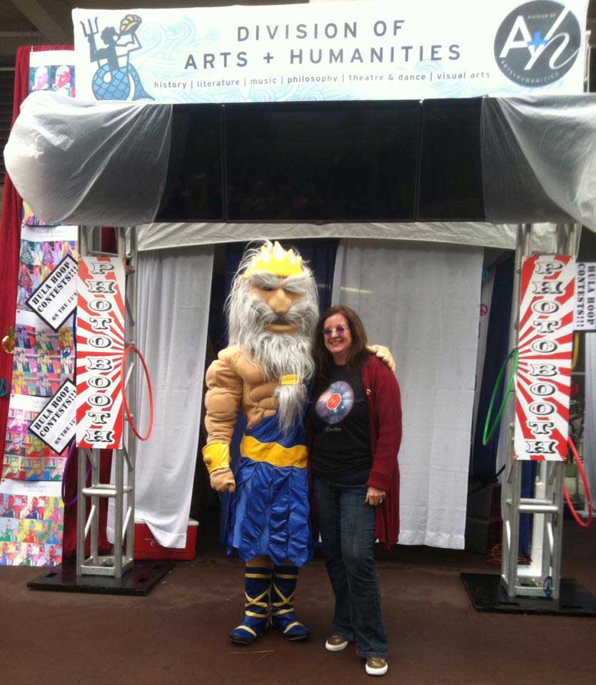 Platero-Lopez takes a picture with King Triton during a university event.