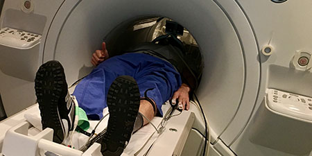 A subject who is preparing to undergo vagus nerve stimulation in the fMRI scanner.