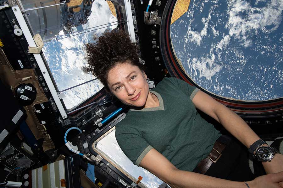 Jessica Meir poses for a portrait inside the International Space Station's cupola.