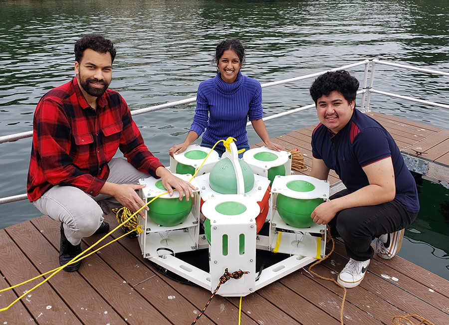 Students S Grimes, Ananya Thridandam and Brandon Orozco test a prototype of their device.